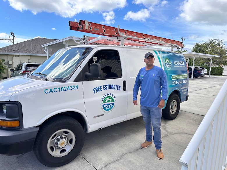 Alvarez technician standing beside the branded service van