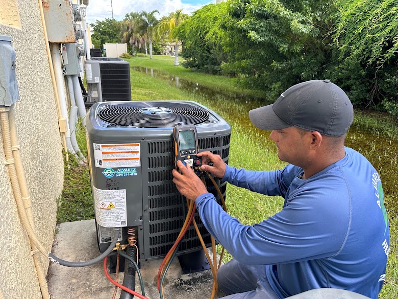 Alvarez technician checking an outdoor air conditioning unit